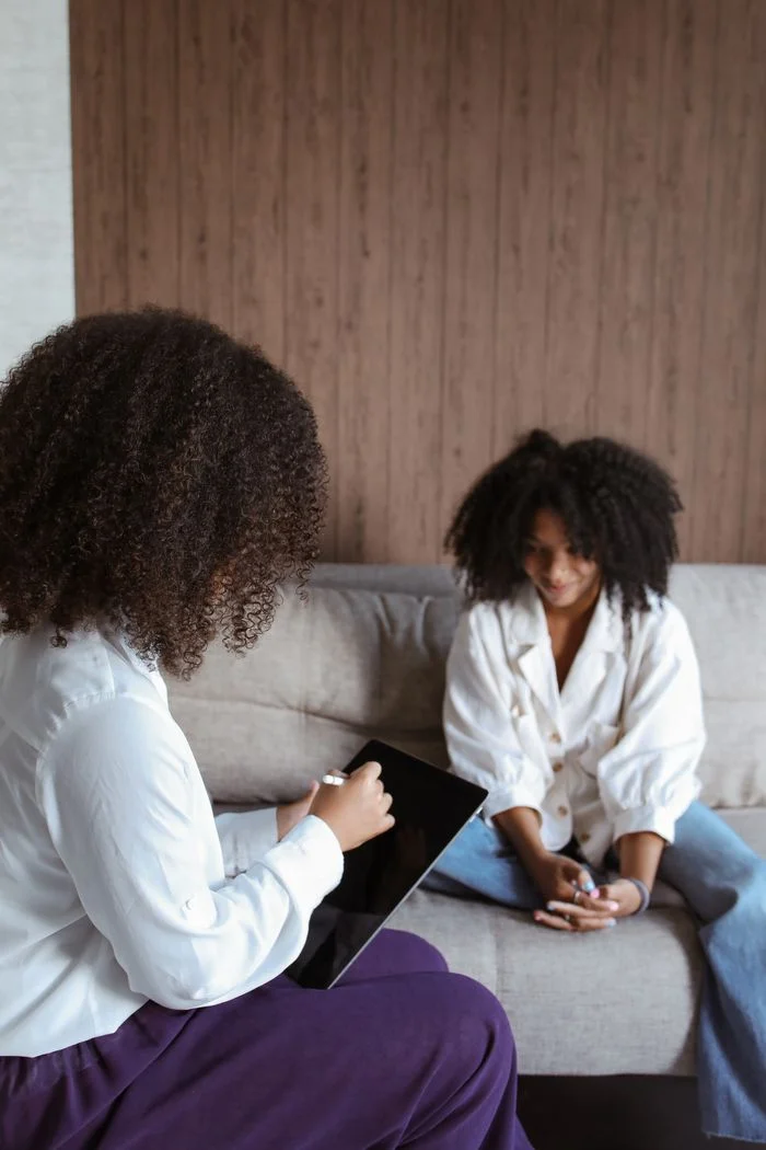 hero-homepage Two women in a psychotherapy session discussing mental health issues.